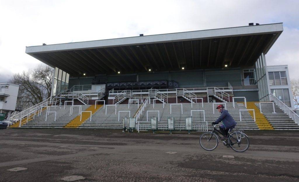 Cycling past the stands, Worcester Racecourse.