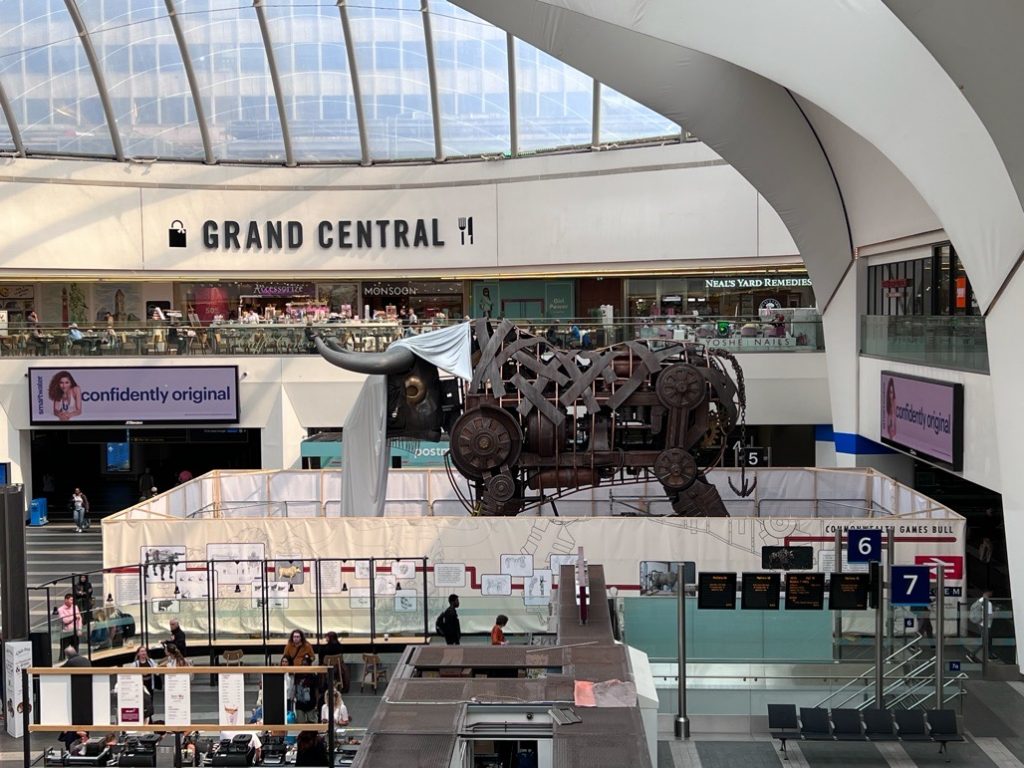 Ozzy the Bull arrives in New Street station, Birmingham. 2023