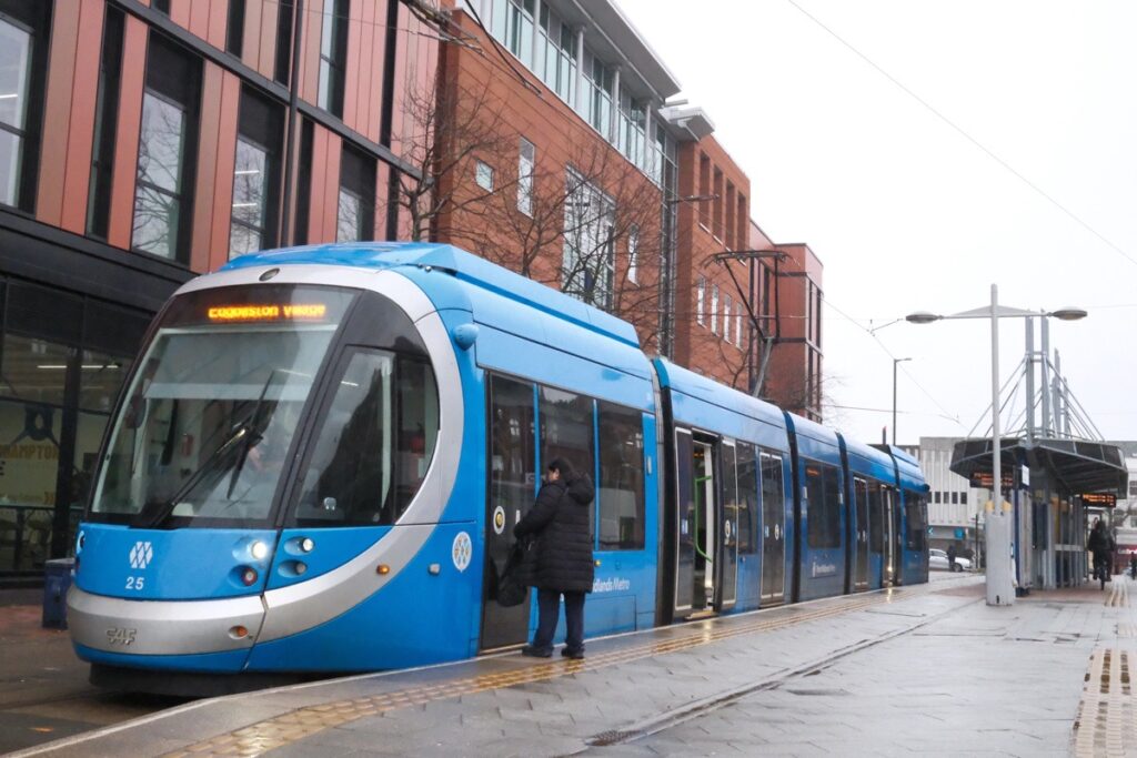 Photographing Wolverhamptoni, catching the tram at Wolverhampton St Georges.