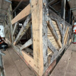 Exposed Structural Frame Wide View Wide shot of the exposed skeletal timber frame of the Golden Lion building.