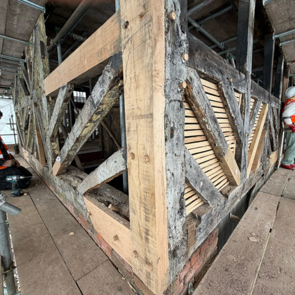 Exposed Structural Frame Wide View Wide shot of the exposed skeletal timber frame of the Golden Lion building.
