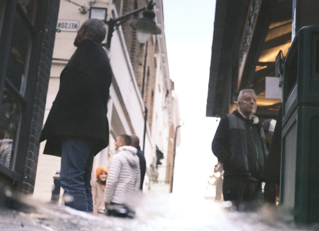 Street scene at Greenwich Market with shoppers and stalls, photographed using the Fujifilm GFX100RF