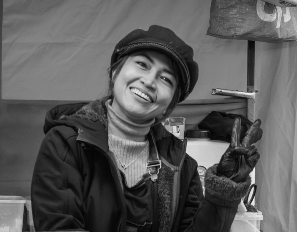 Happiness on the street. Street photographer capturing candid moments inside Greenwich Market.