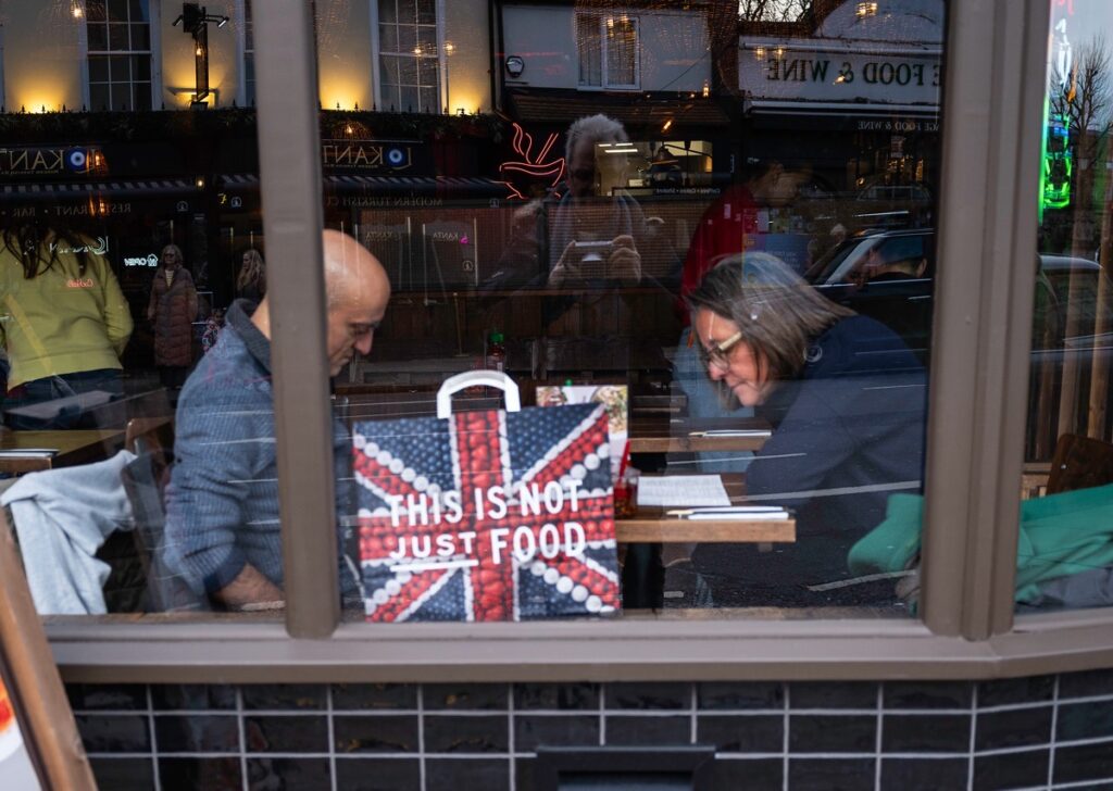 Busy Greenwich Market scene with reflections and natural light