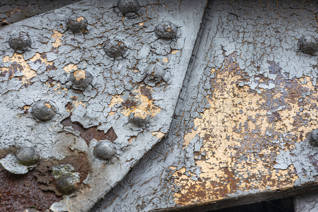 Stannels Bridge shows patterns of rust and peeling paintwork.