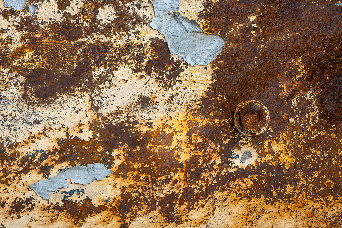 Stannels Bridge shows patterns of rust and peeling paintwork.