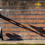 A long shadow on the towpath near to Brindley Place.