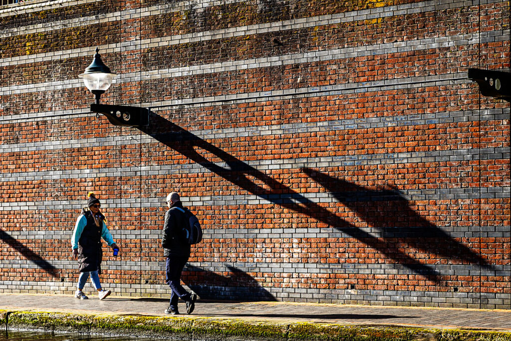 A chance meeting under a shadow.
