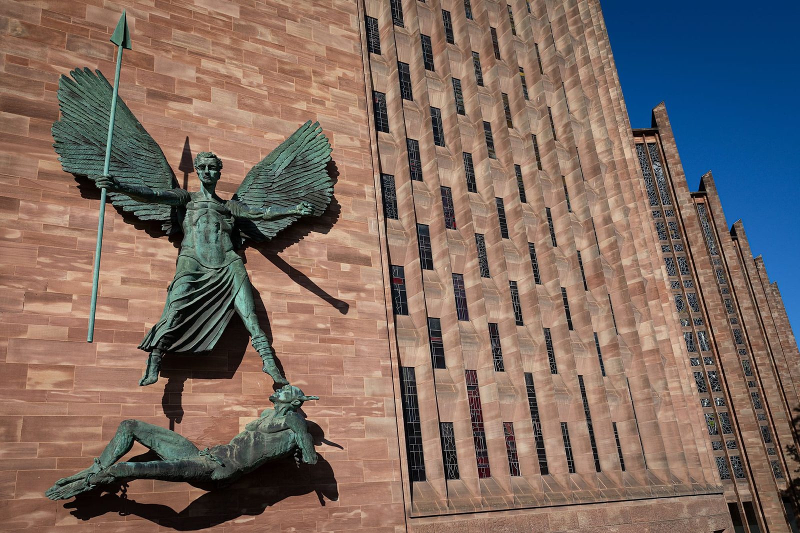 Classic view of the statue of St Micheal, the archangel over Lucifer