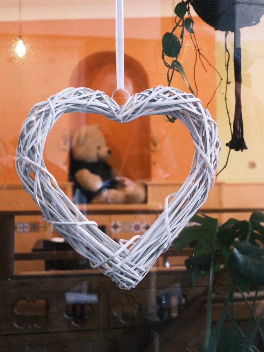 Street scene at Greenwich Market with framed Teddy in a heart, photographed using the Fujifilm GFX100RF