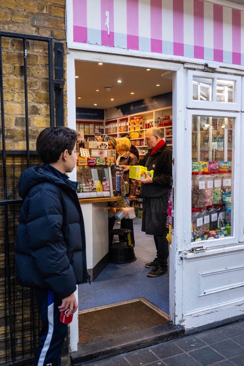 Street scene at Greenwich Market with shoppers and stalls, photographed using the Fujifilm GFX100RF
