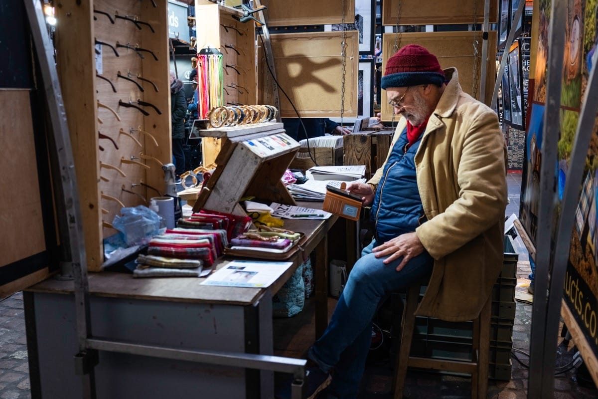 Candid portrait of a shop keeper at Greenwich market. GFX100RF